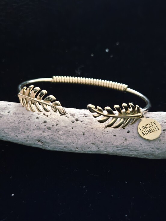 Kinsley Armelle Jewelry - Kinsley Armelle Gold Leaf Open Cuff Bracelet with Branded Charm